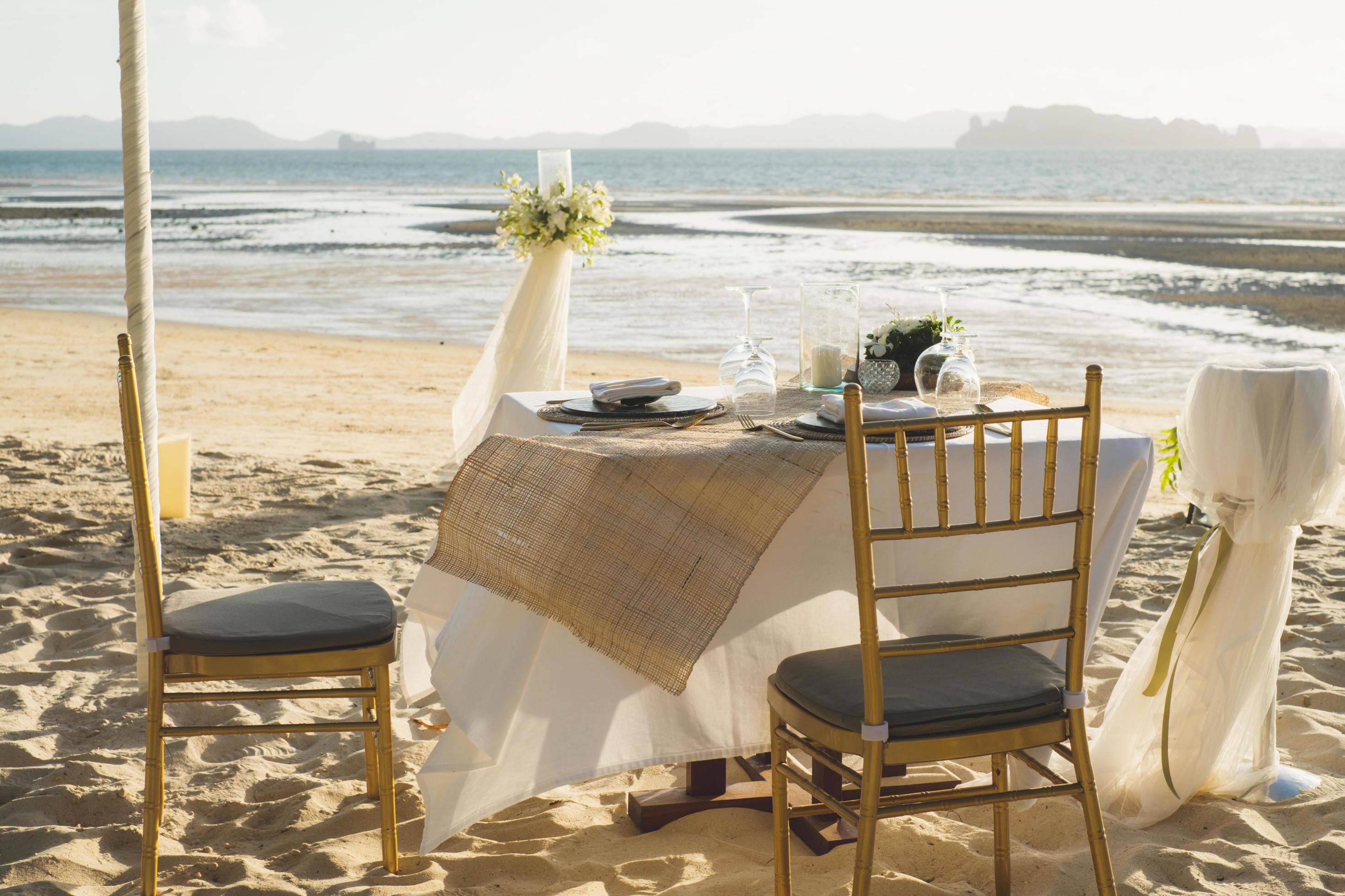 A table for two above the sea at sunset