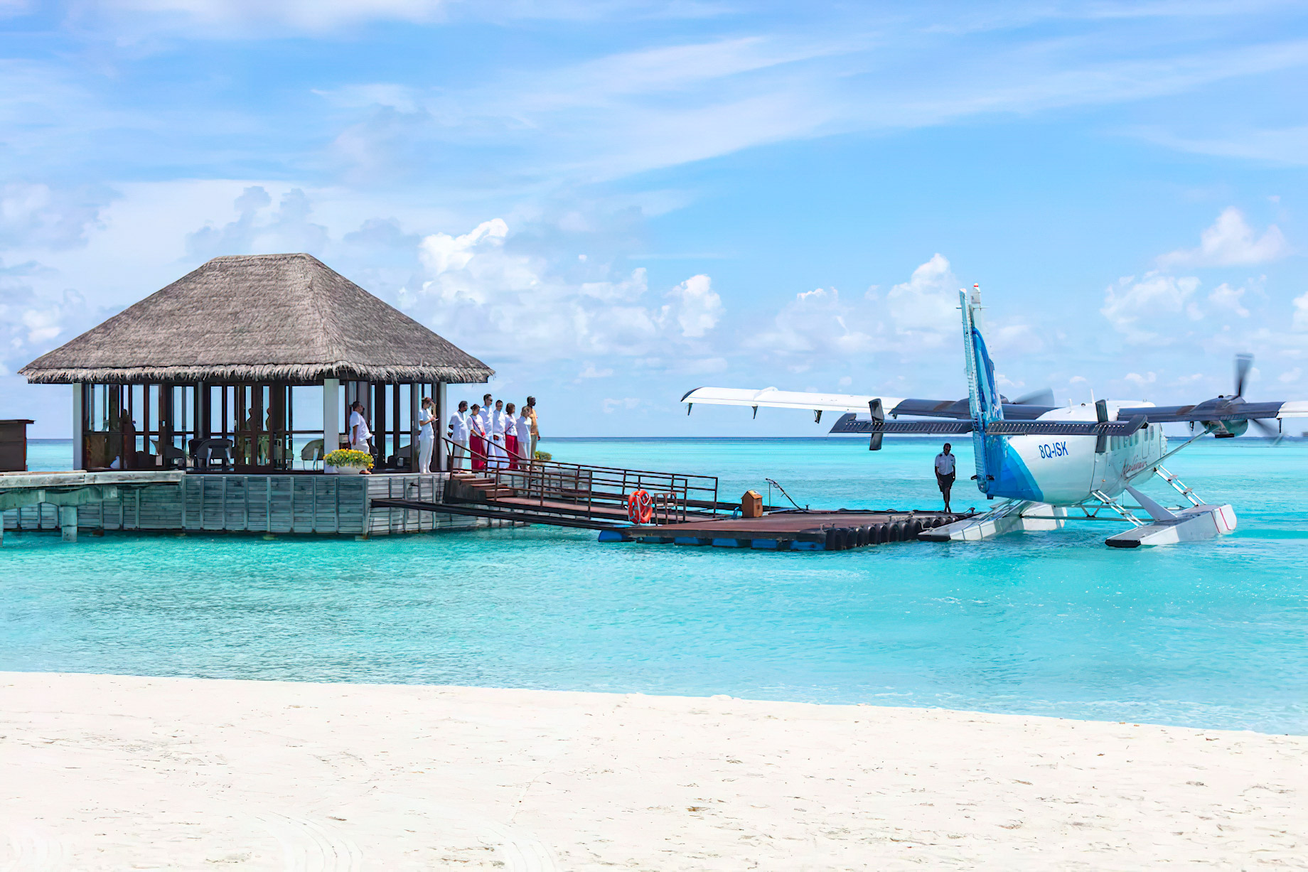 A seaplane on a turquoise lagoon